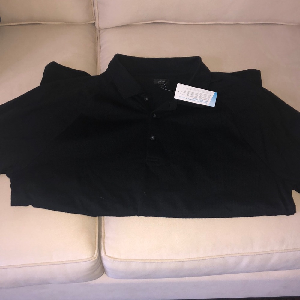 Black coolmax cotton/poly mesh polo with tags still on.